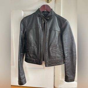 Vintage 1969 Gap black leather motorcycle jacket.